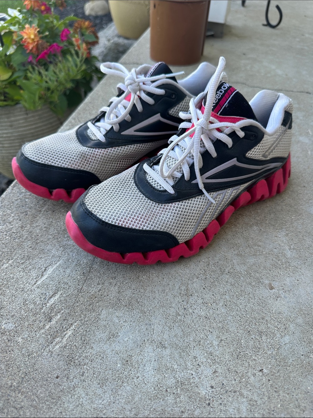 Reebok pink and grey women’s tennis shoes size 9.5
